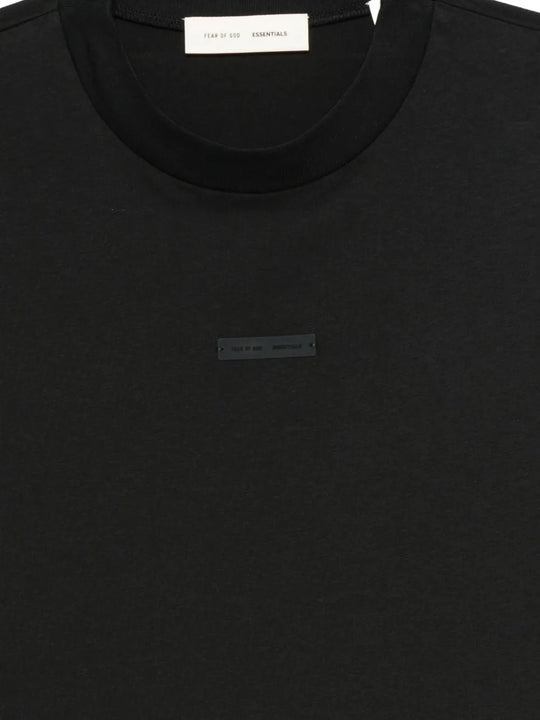 Close up of the black t-shirt, showing texture of the cotton fabric