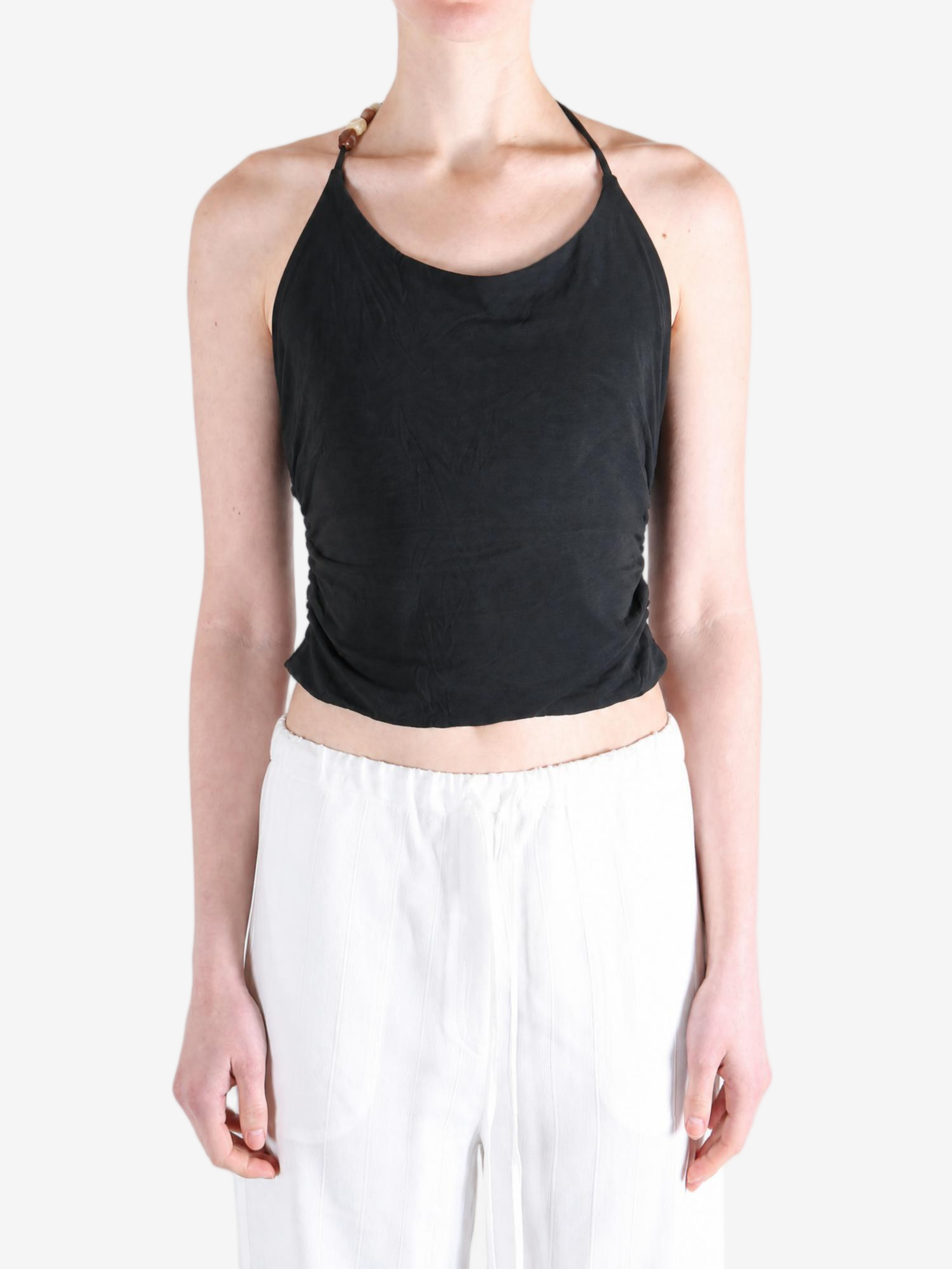 Black top worn by a person, showing the top fit