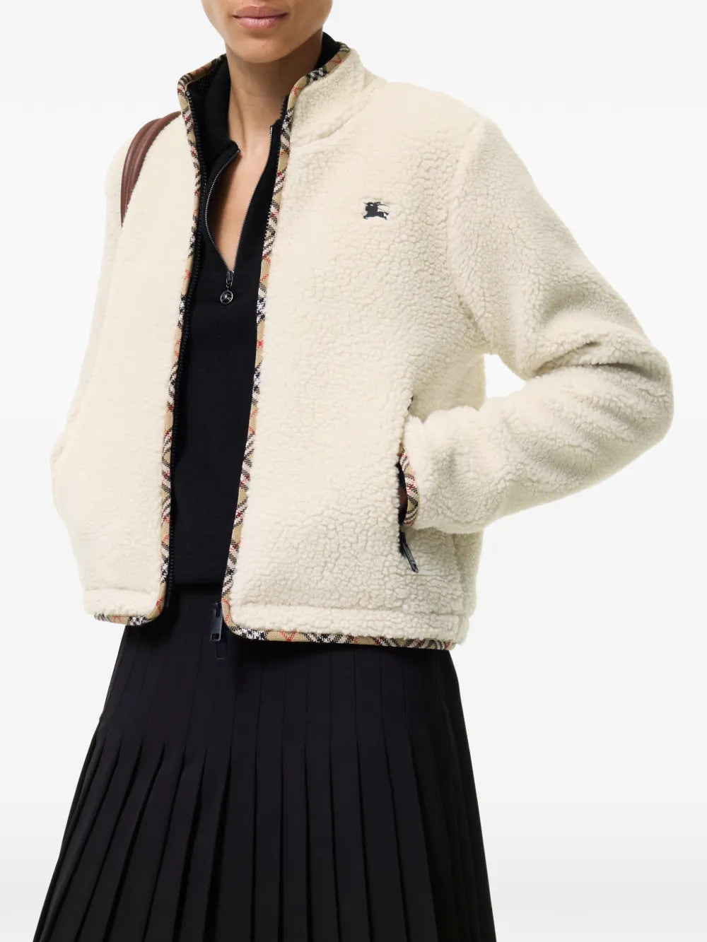 Tan jacket worn by a person, showing the jacket fit
