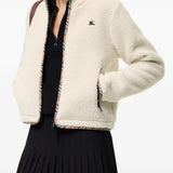 Tan jacket worn by a person, showing the jacket fit