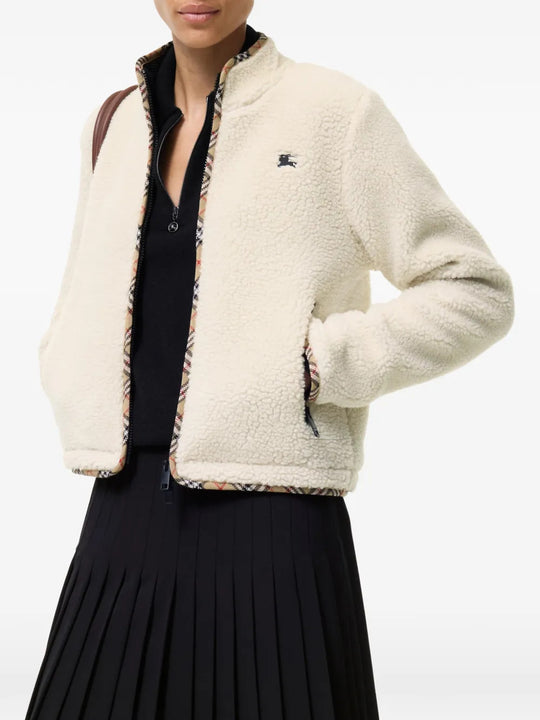 Tan jacket worn by a person, showing the jacket fit