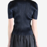 Navy top worn by a person, showing the top's fit