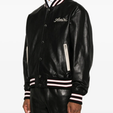 Black jacket worn by a person, showing the jacket fit