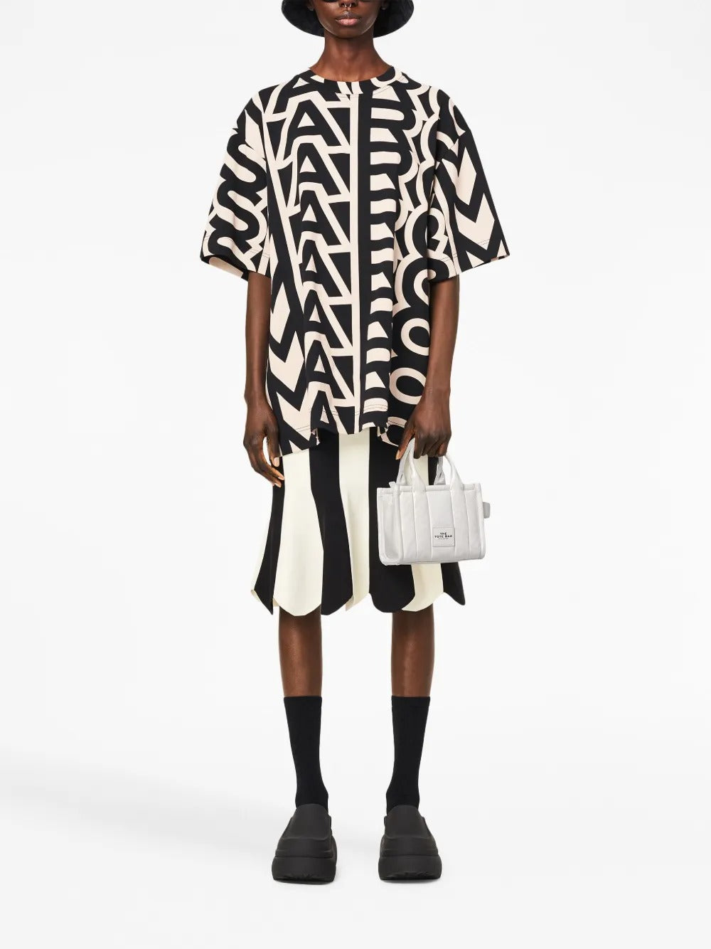 White bag worn by a person, showing the bag's fit