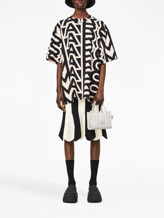 White bag worn by a person, showing the bag's fit