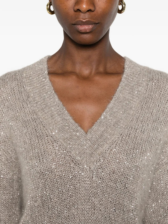 Tan hoodie worn by a person, showing the hoodie fit