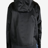 Black jacket worn by a person, showing the jacket's fit