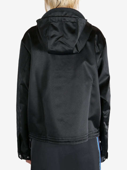 Black jacket worn by a person, showing the jacket's fit