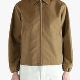 Brown jacket worn by a person, showing the jacket fit