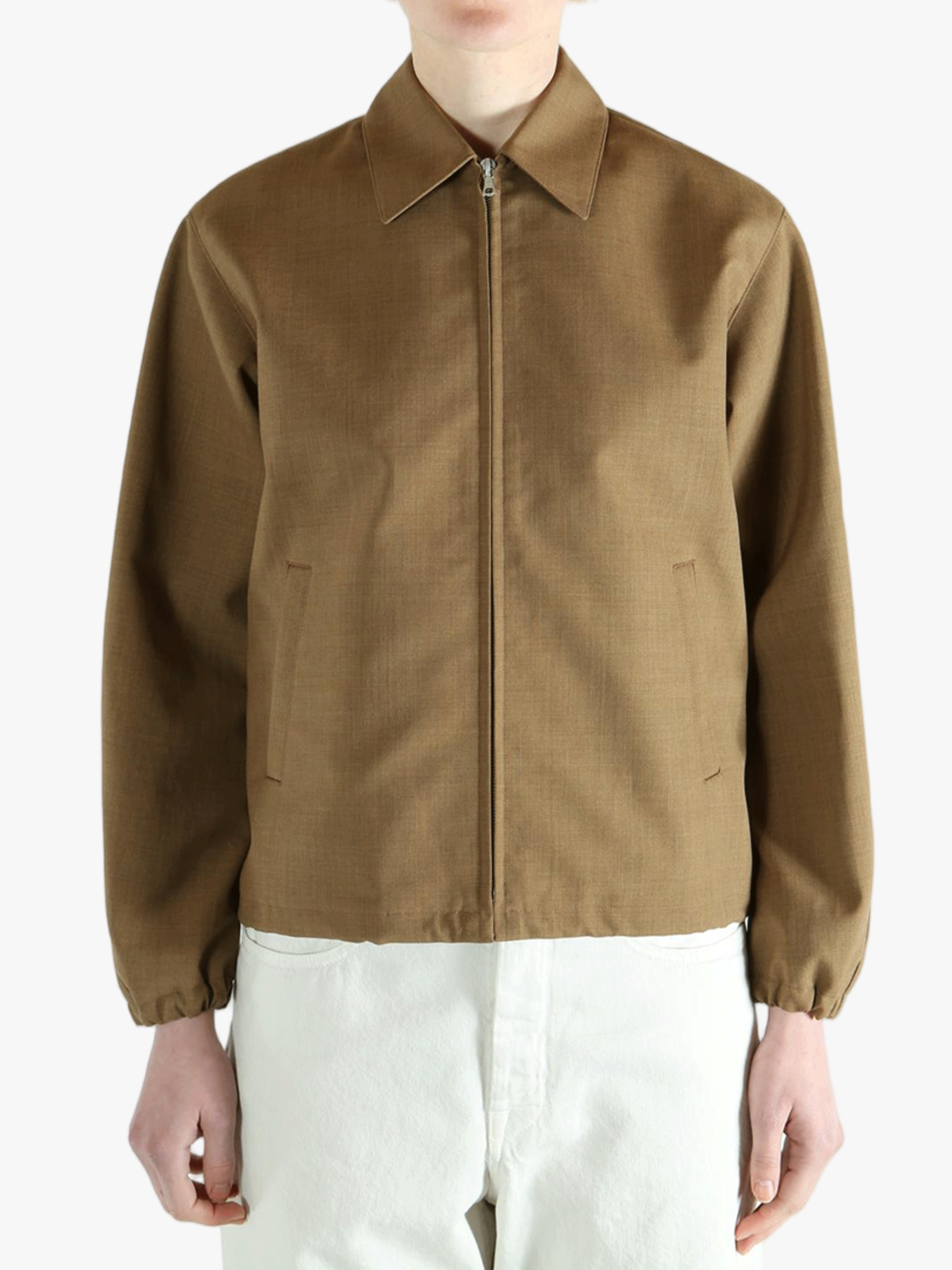 Brown jacket worn by a person, showing the jacket fit