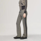 Grey pants worn by a person, showing the pants' fit