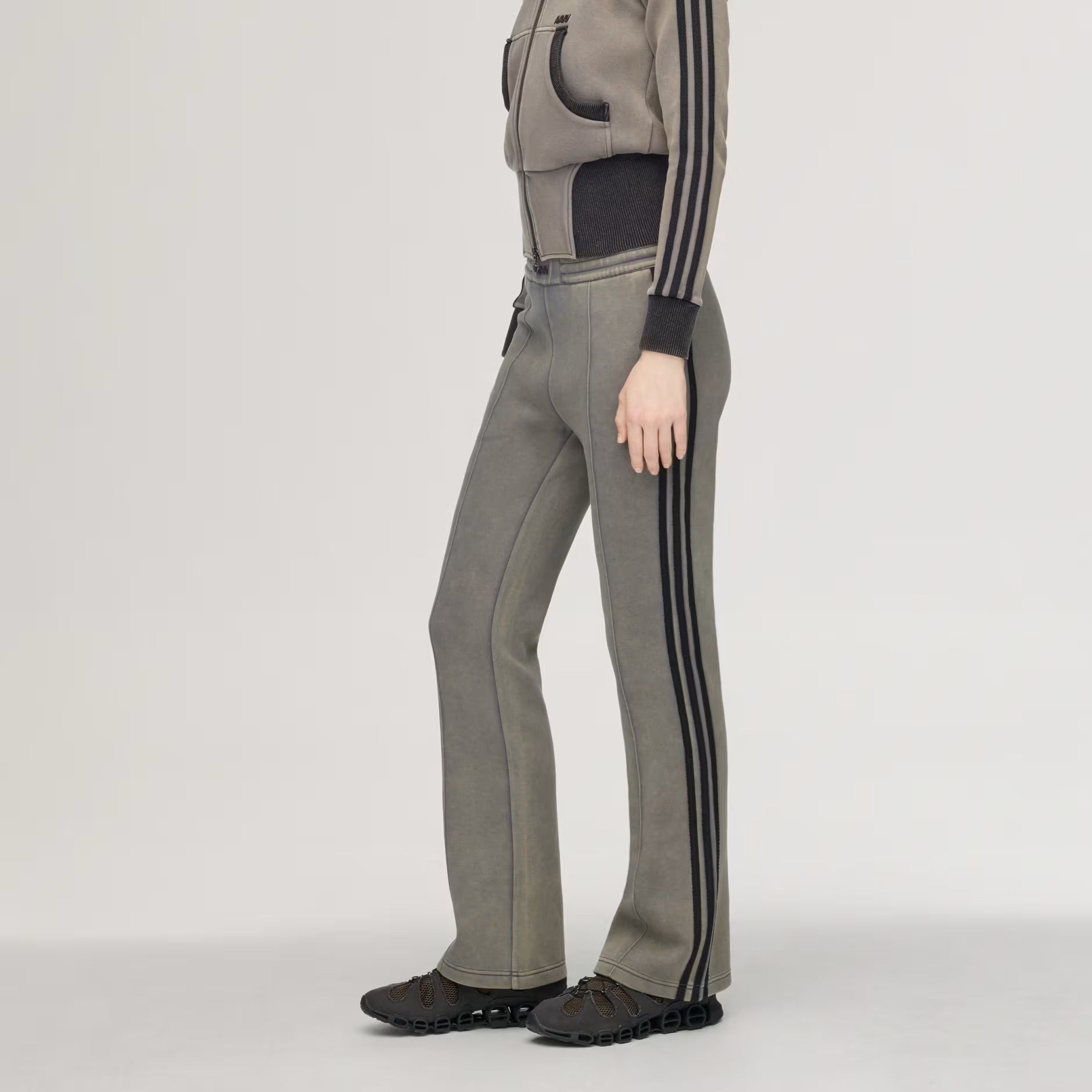 Grey pants worn by a person, showing the pants' fit
