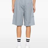 Grey shorts worn by a person, showing the shorts fit