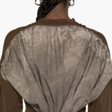 Close up of brown  knitwear, showing texture of the Cotton and Silk  fabric