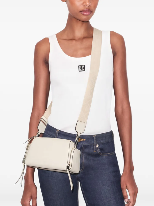 Tan bag worn by a person, showing the bag fit