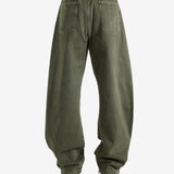 Green pants worn by a person, showing the pants fit