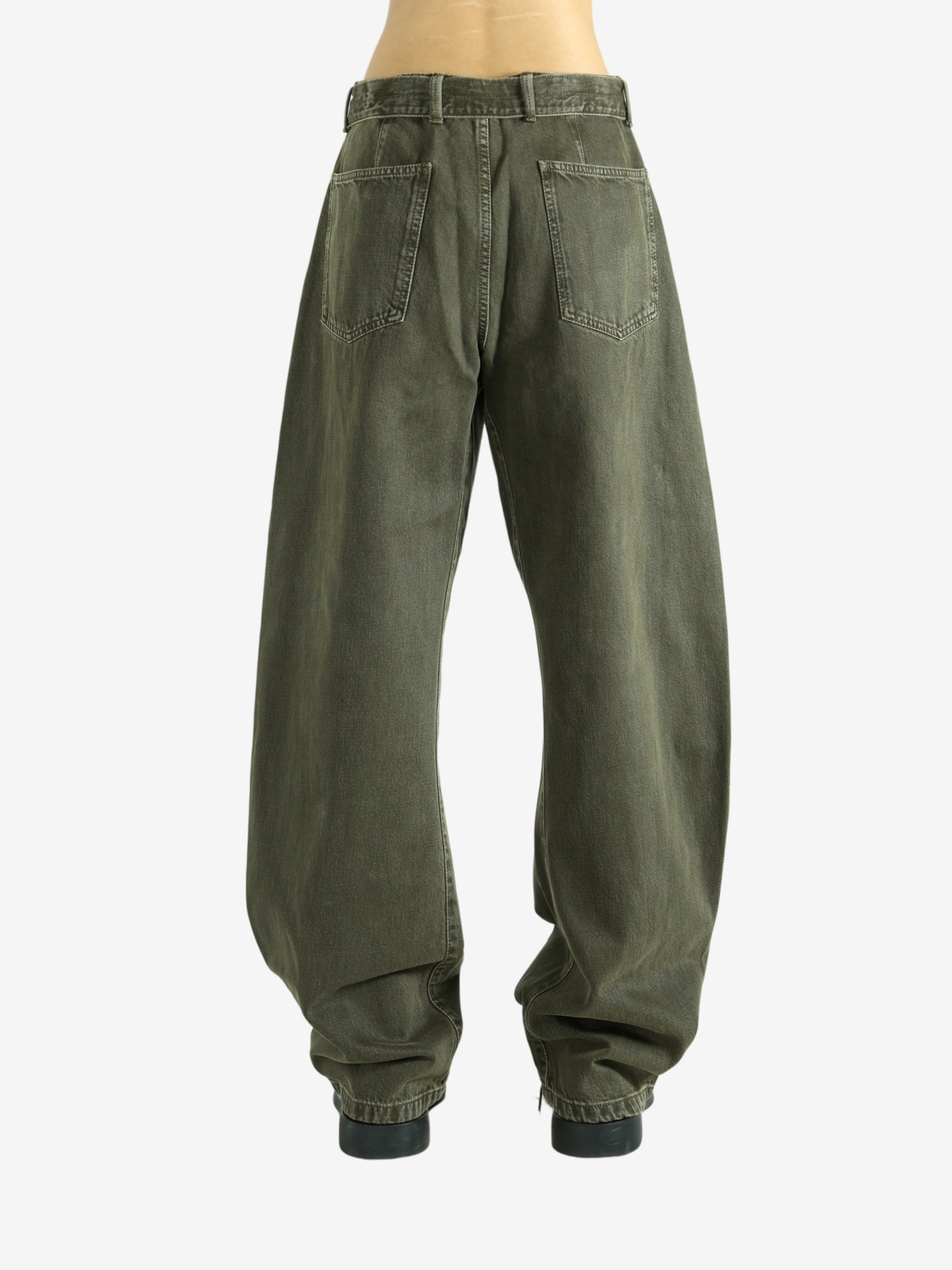 Green pants worn by a person, showing the pants fit