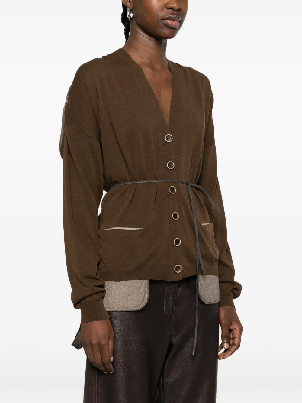 Brown knitwear worn by a person, showing the knitwear fit