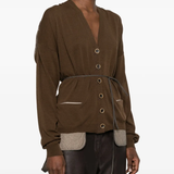 Brown knitwear worn by a person, showing the knitwear fit