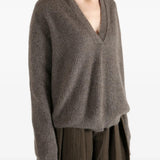 Brown top worn by a person, showing the top fit