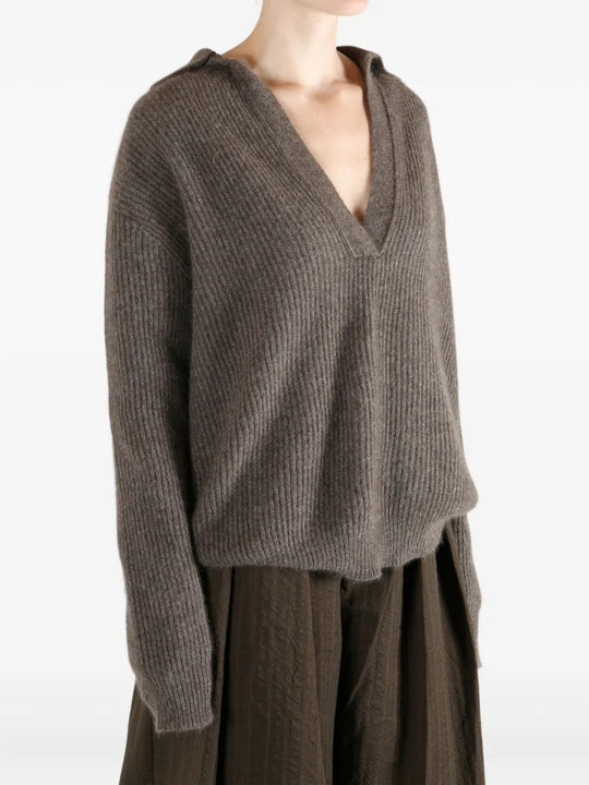 Brown top worn by a person, showing the top fit