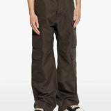 Brown pants worn by a person, showing the pants fit