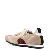 Tan sneakers, side view