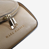 Close up of brown bag, showing texture of the leather fabric
