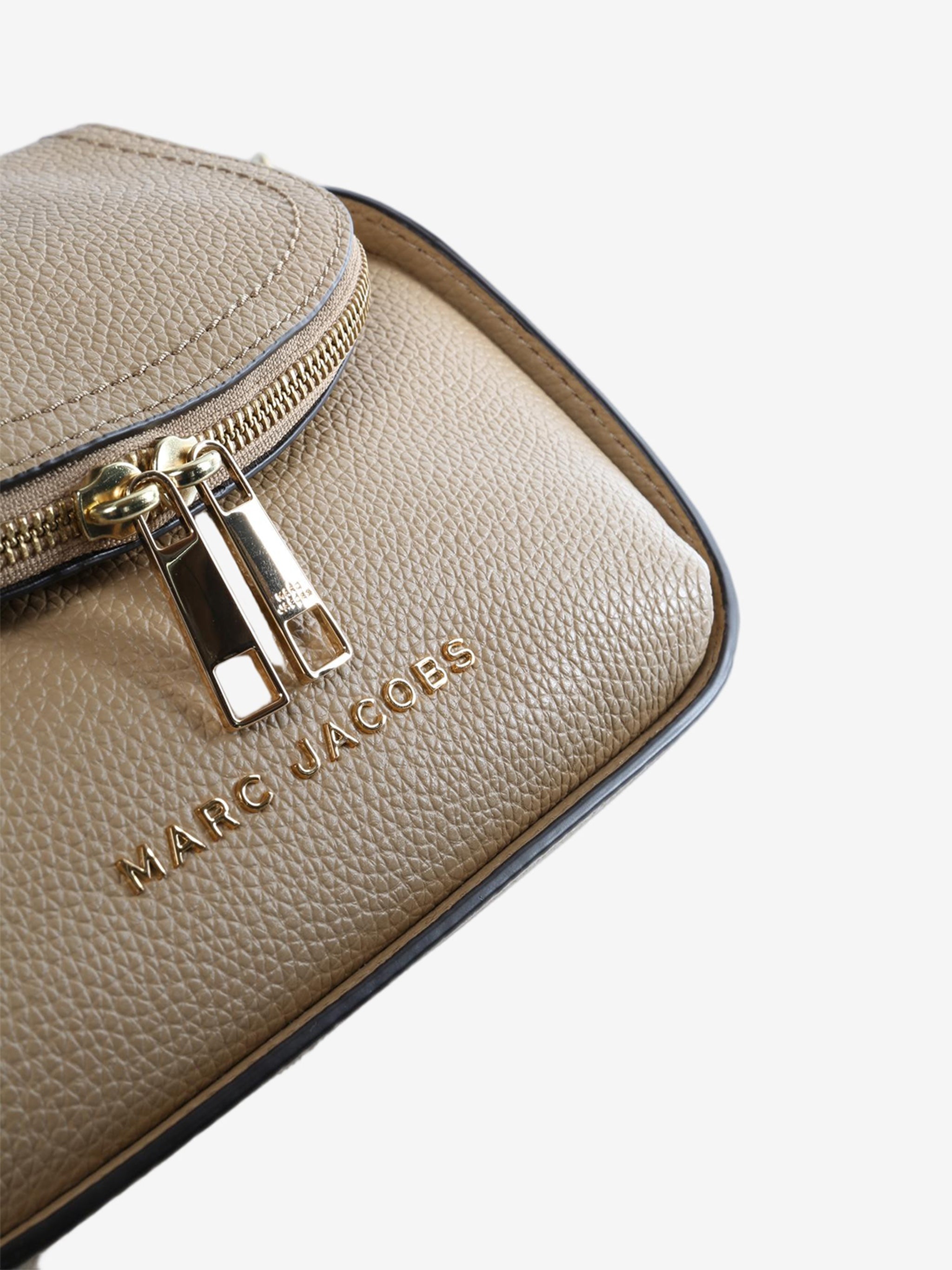 Close up of brown bag, showing texture of the leather fabric