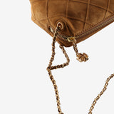 Close up of brown bags, showing texture of the fabric