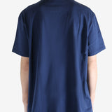 Navy blue t-shirt worn by a person, showing the shirt's fit