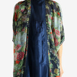 Green top worn by a person, showing the top fit