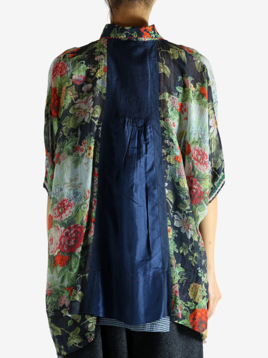 Green top worn by a person, showing the top fit