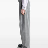 Grey pants worn by a person, showing the pants' fit