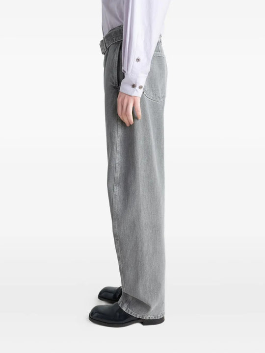 Grey pants worn by a person, showing the pants' fit