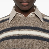 Tan hoodie worn by a person, showing the hoodie fit