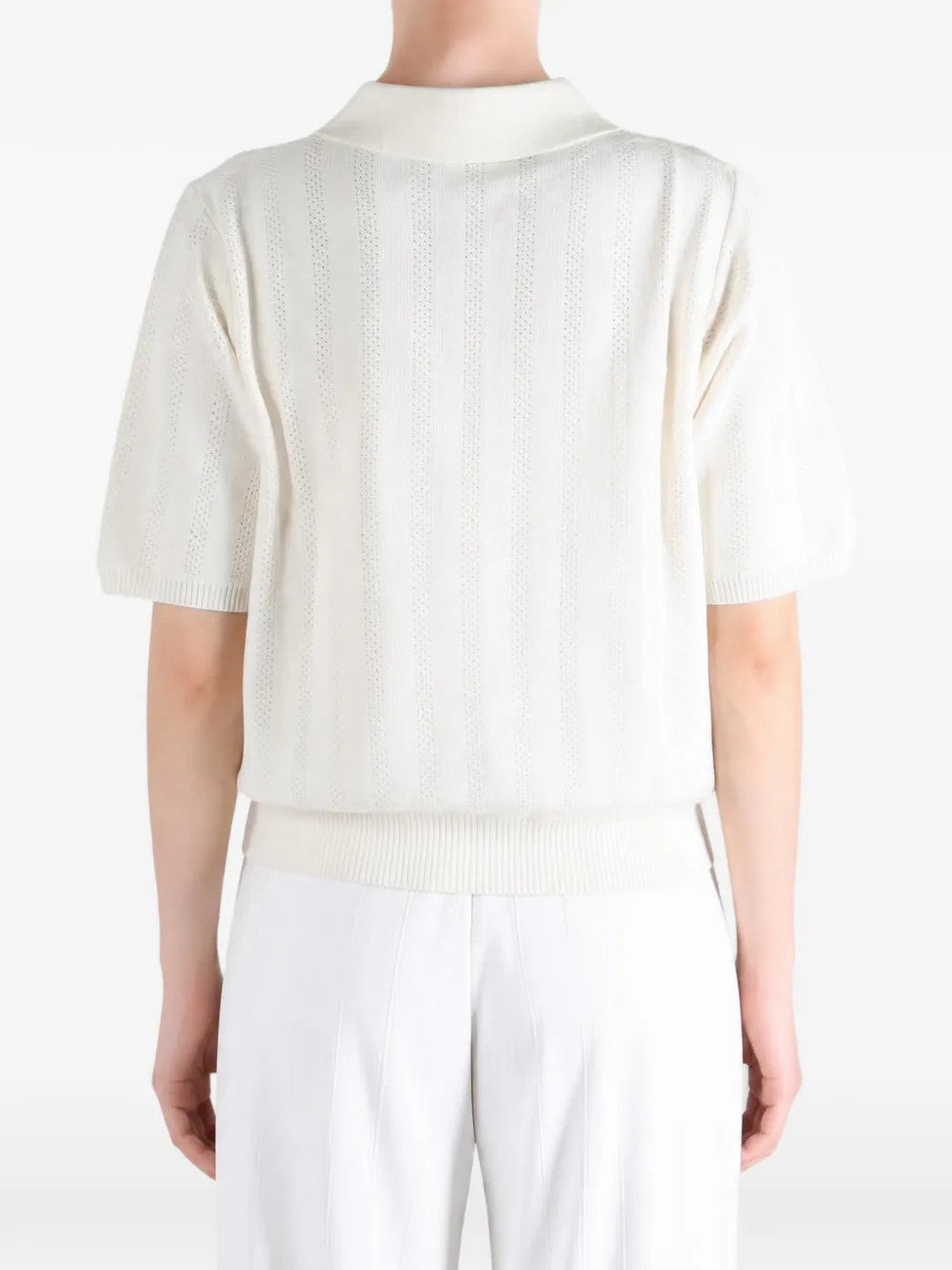 White shirt worn by a person, showing the shirt fit