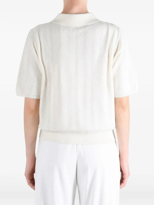 White shirt worn by a person, showing the shirt fit