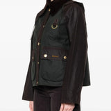 Green jacket worn by a person, showing the jacket's fit