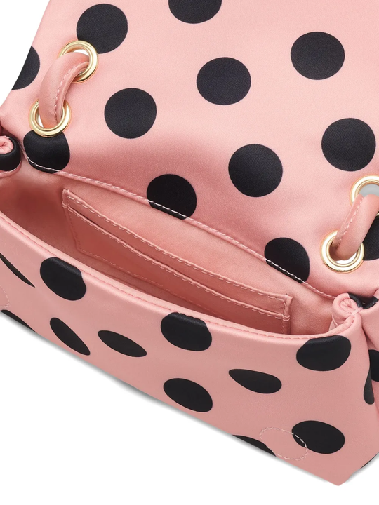 Close up of pink bag,showing texture of the polyester fabric.