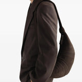 Brown bag worn by a person, showing the bag fit