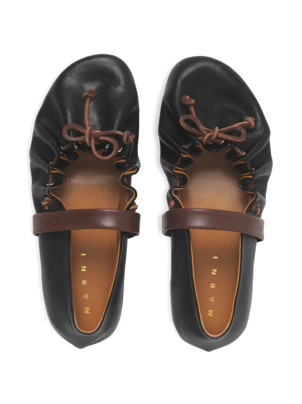 Close up of black flats, showing texture of the Bovine Leather fabric