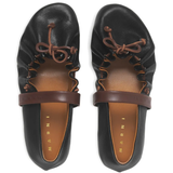 Close up of black flats, showing texture of the Bovine Leather fabric