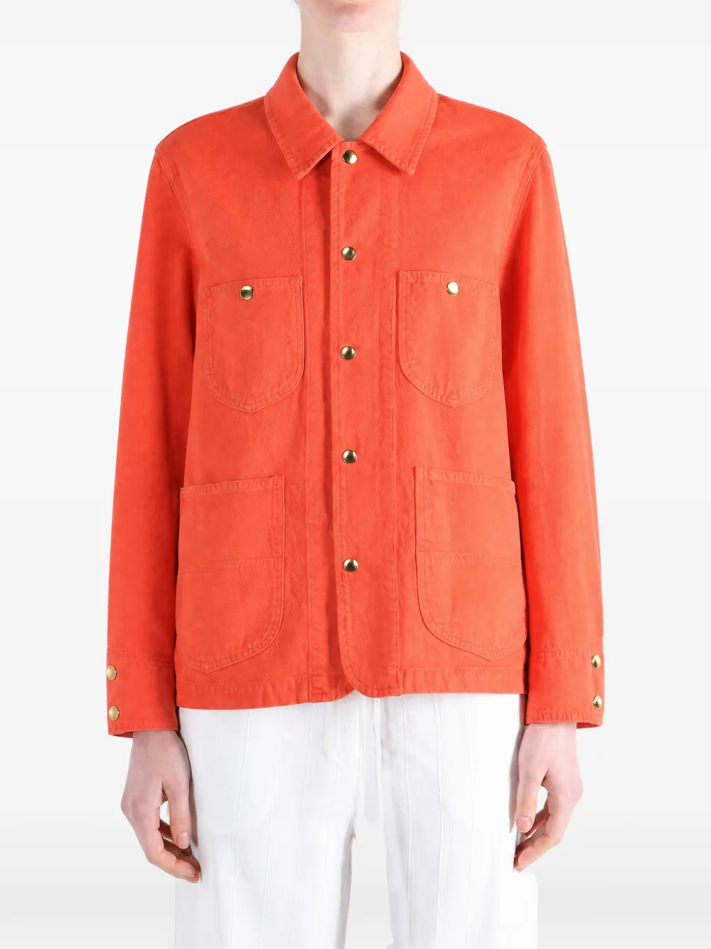 Orange jacket worn by a person, showing the jacket fit