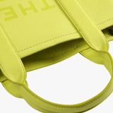 Close up of the green bag, showing texture of the leather fabric