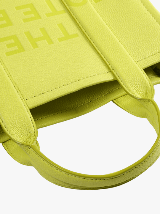 Close up of the green bag, showing texture of the leather fabric