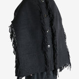 Black jacket worn by a person, showing the jacket's fit