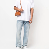 White T-shirt worn by a person, showing the T-shirt's fit