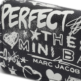 Close up of black bag, showing texture of the leather fabric