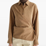 Tan dress worn by a person, showing the dress fit